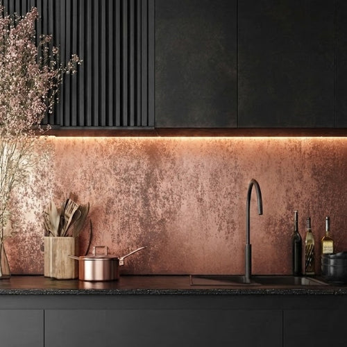 Modern kitchen with matte black cabinets and copper splashack with hints of dark patina