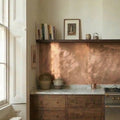 Victorian Kitchen with wooden cabinets, copper backsplash, and a large stove.
