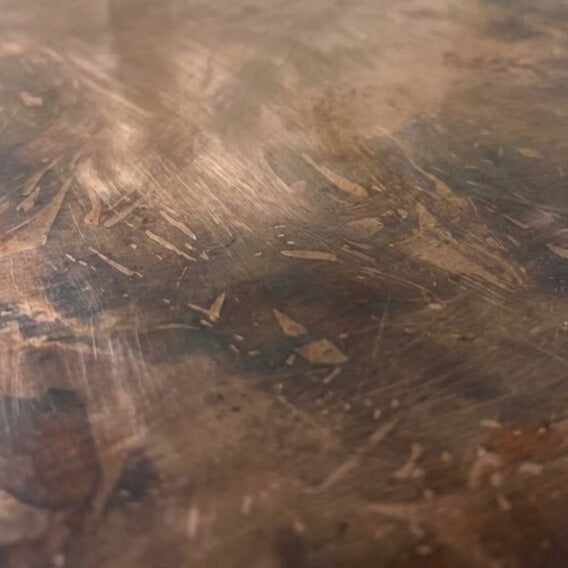 Close-up of a rich dark copper patina
